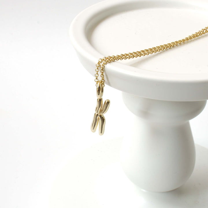 Chromosome pendant in 14K gold plated brass by Ontogenie Science Jewelry