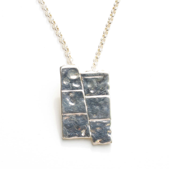 Dip slip fault pendant in sterling silver by ontogenie science jewelry