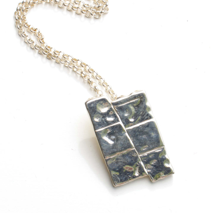Dip slip fault pendant in sterling silver by ontogenie science jewelry