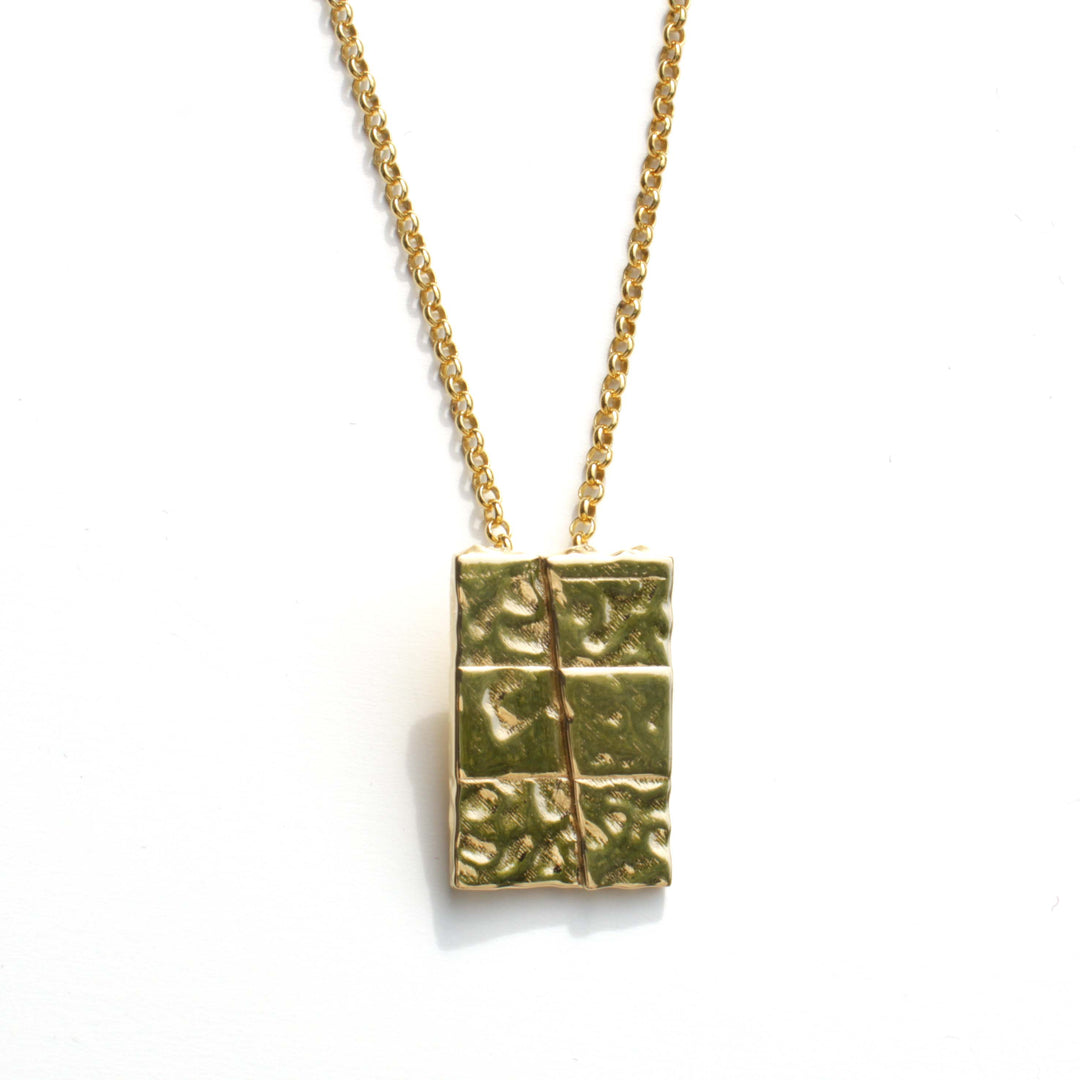 strike slip pendant in 14K gold plated brass by ontogenie science jewelry