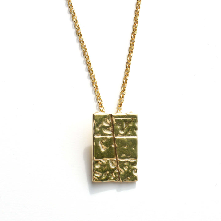 strike slip pendant in 14K gold plated brass by ontogenie science jewelry