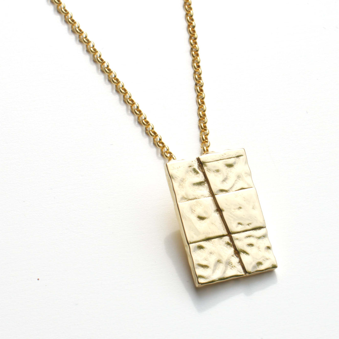 strike slip pendant in 14K gold plated brass by ontogenie science jewelry