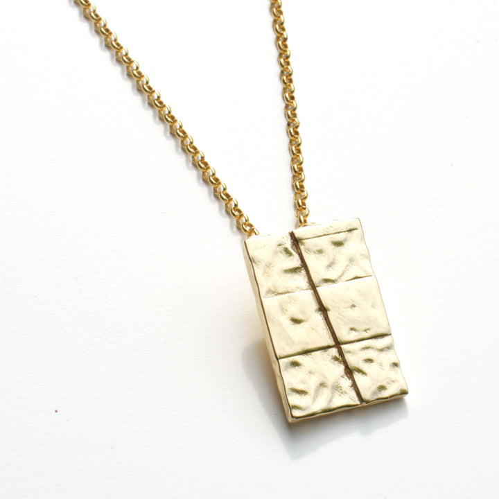 strike slip pendant in 14K gold plated brass by ontogenie science jewelry