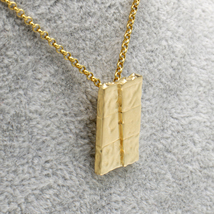 strike slip pendant in 14K gold plated brass ontogenie science jewelry