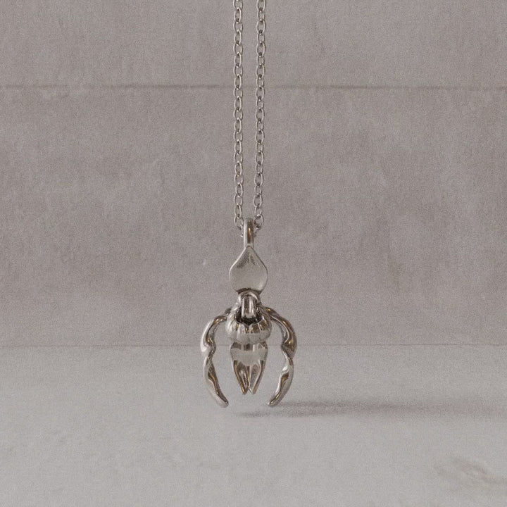 Lady's slipper pendant in sterling silver rotation video Ontogenie Science Jewelry