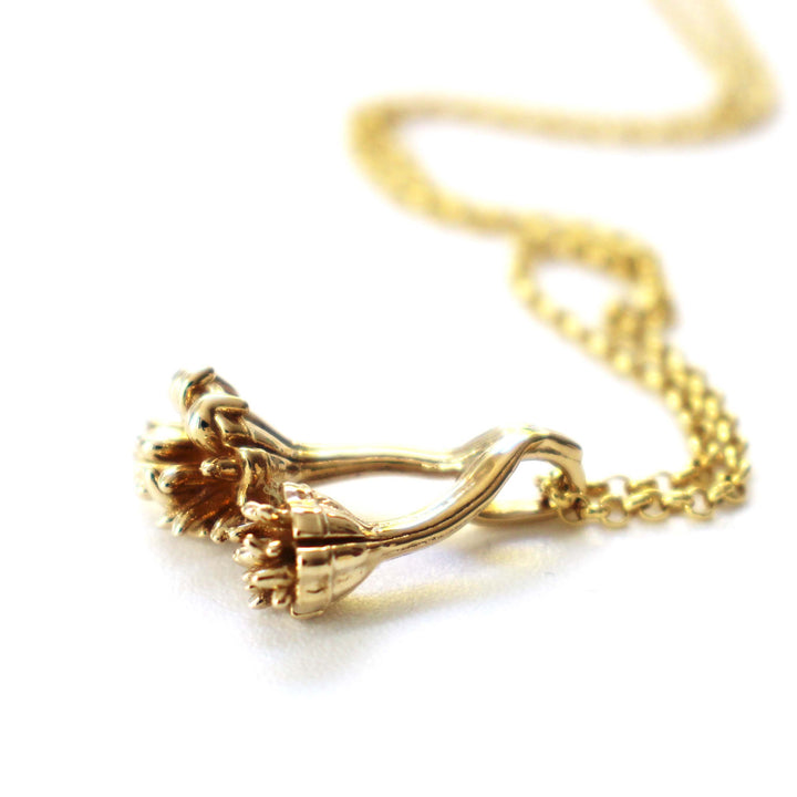 Auroralumina Fossil Pendant in polished brass by Ontogenie Science Jewelry