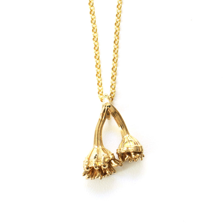 Auroralumina Fossil Pendant in polished brass by Ontogenie Science Jewelry