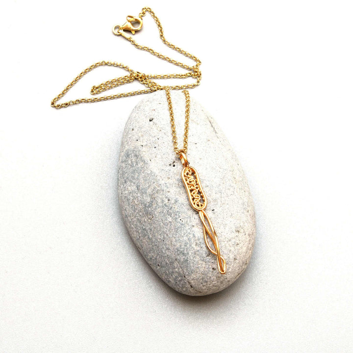 bacterial cell pendant in 14K gold plated brass by ontogenie science jewelry