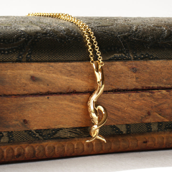 C elegans pendant in 14K gold plated brass by Ontogenie Science Jewelry
