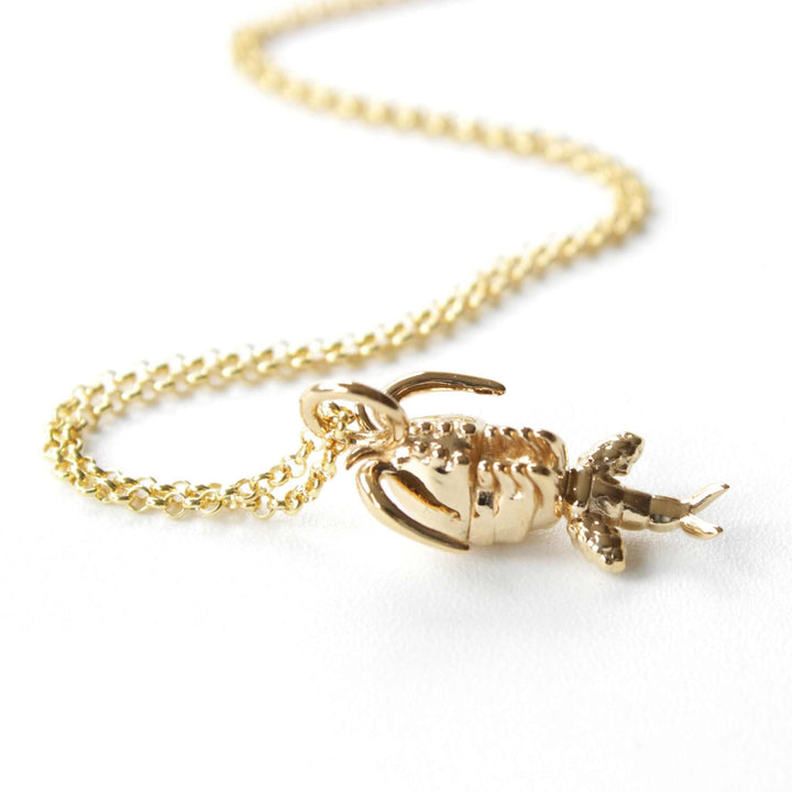 copepod pendant in 14K gold plated brass ontogenie science jewelry