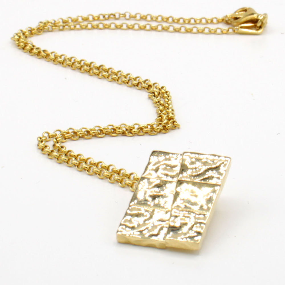 strike slip pendant in 14K gold plated brass ontogenie science jewelry