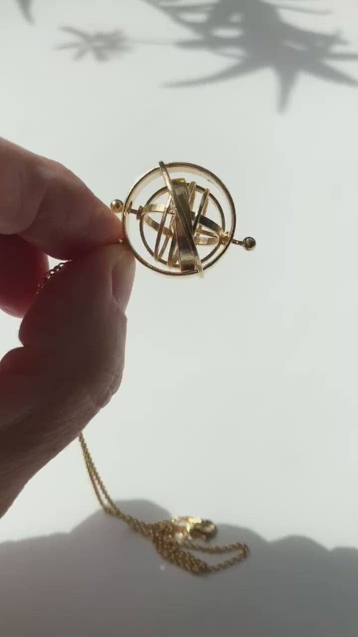 Armillary sphere pendant in brass by ontogenie science jewelry