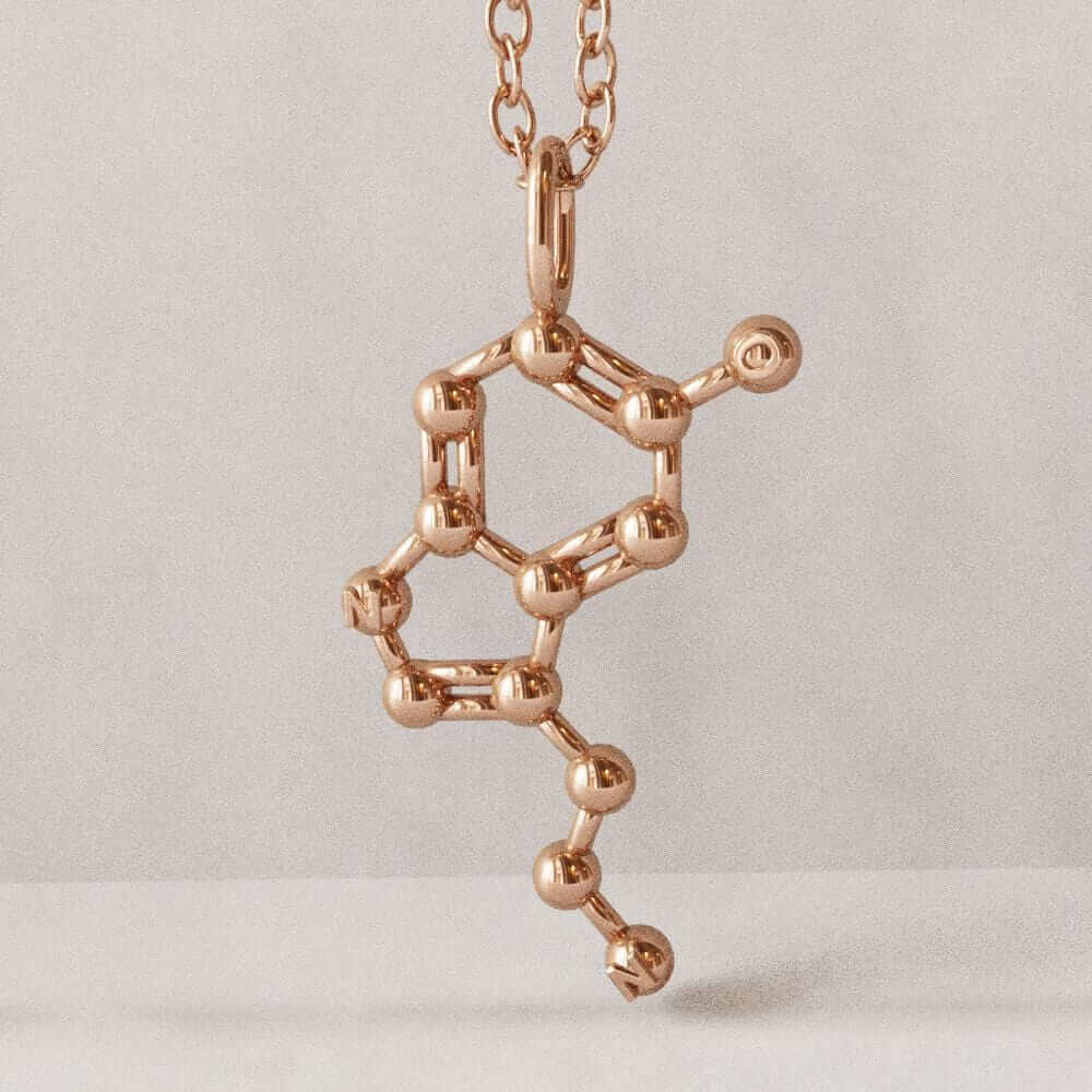 Serotonin molecule pendant rose gold plated brass computer render ontogenie science jewelry