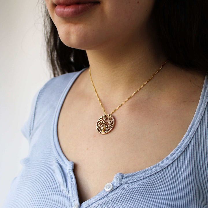 biology inspired jewelry Animal cell pendant in bronze on model by Ontogenie science jewelry