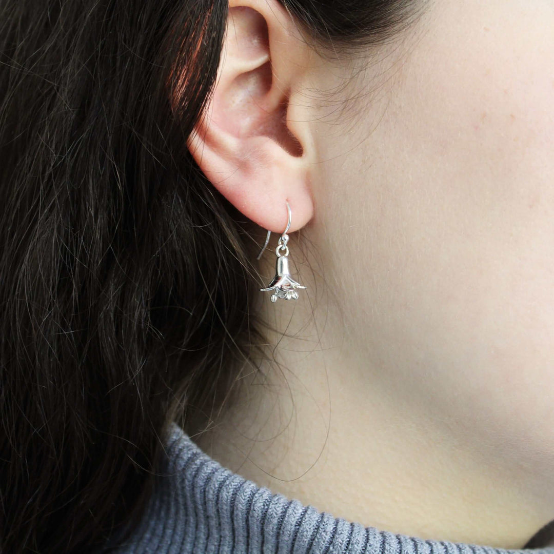 silver arabidopsis flower earrings on model Ontogenie