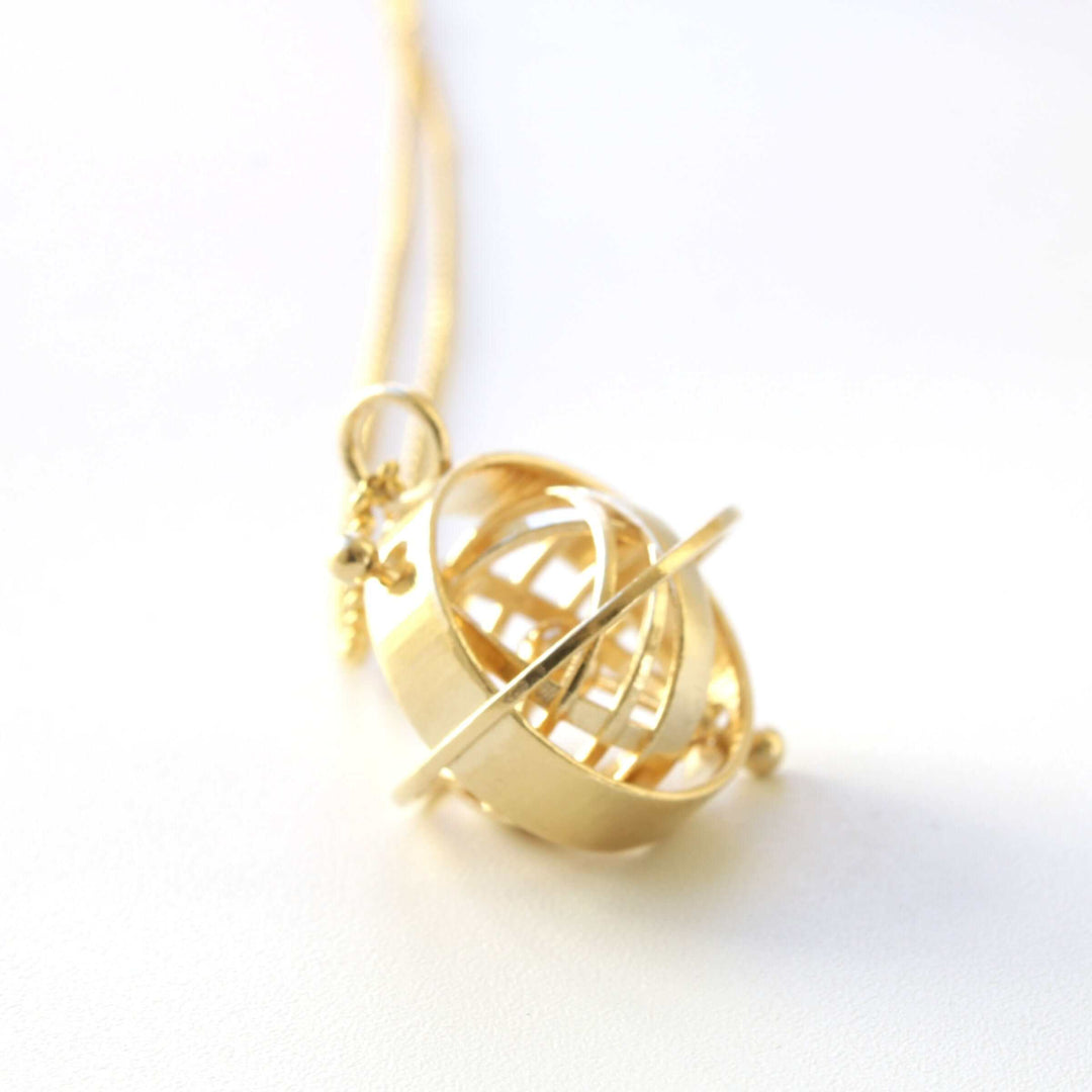 Armillary sphere pendant in brass by ontogenie science jewelry