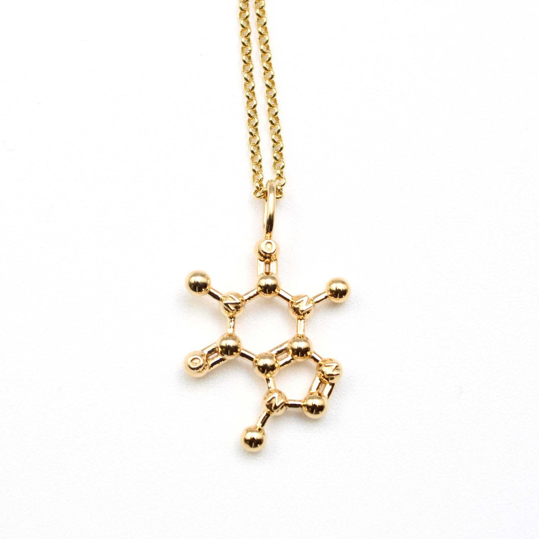 caffeine pendant in gold plated brass molecular jewelry by ontogenie