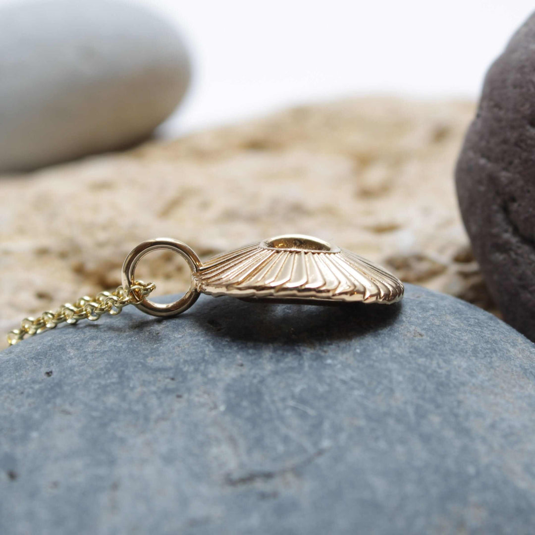 Side view of Single Coccolith pendant 14K gold plated brass marine biology jewelry Ontogenie