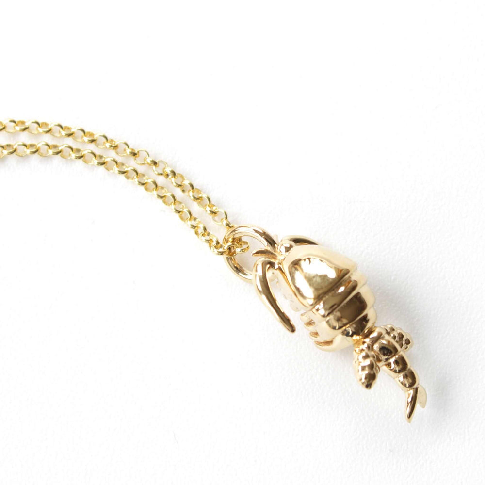 copepod pendant in 14K gold plated brass ontogenie science jewelry