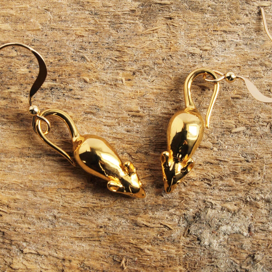 14K Gold plated brass mouse earrings on rough wood background Ontogenie Science Jewelry