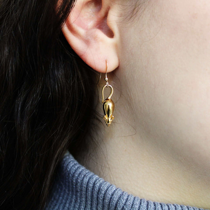 Mouse earrings in gold plated brass on model Ontogenie