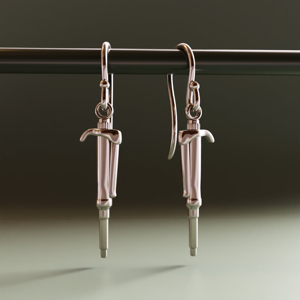 computer render of silver pipette earrings by Ontogenie Science Jewelry