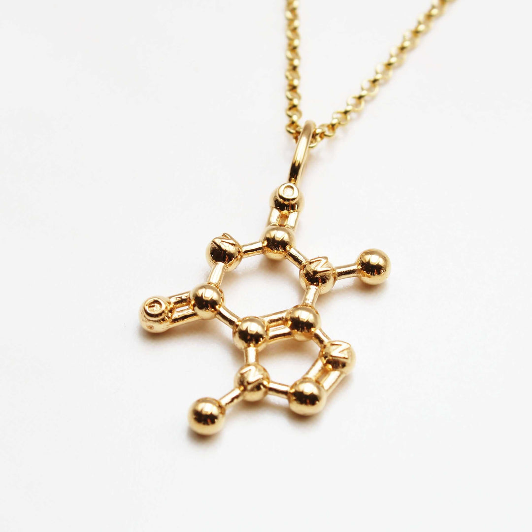 theobromine chocolate pendant in gold plated brass ontogenie science jewelry